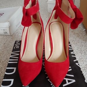 Red suede pumps